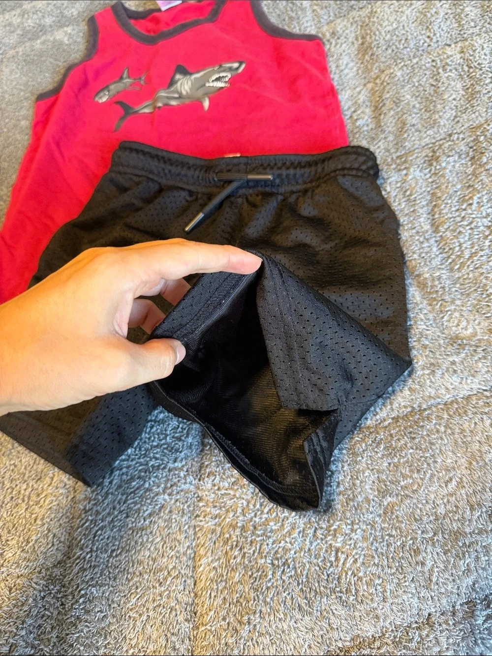 Red Shark Tank Top with Black Athletic Shorts